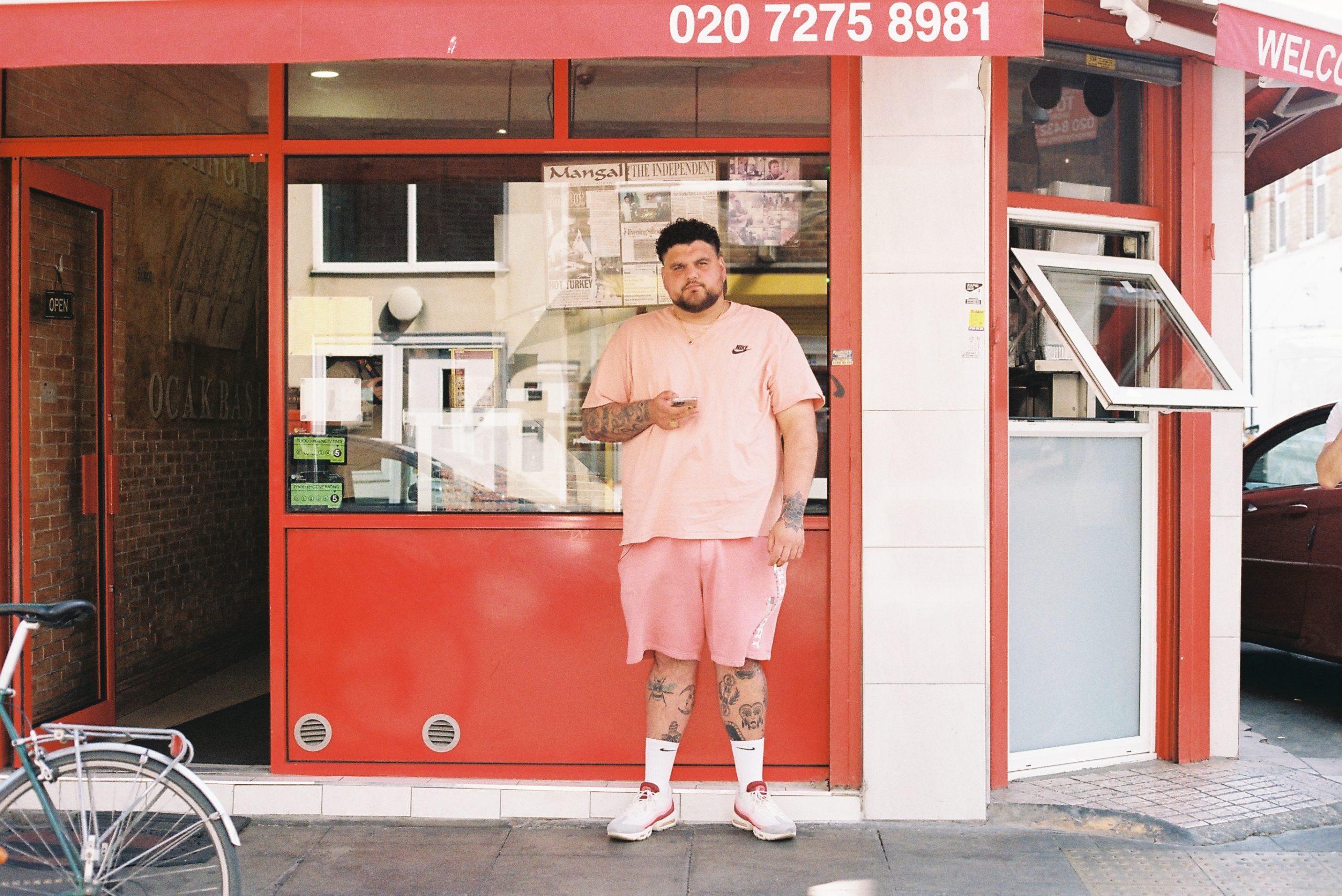 Big Has standing in front of a restaurant